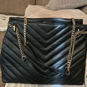 Large black purse from brand called New Day. In excellent condition.